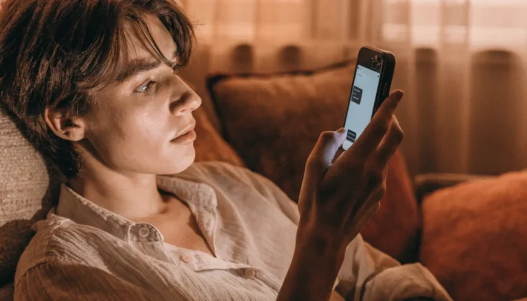 Person confused looking at phone with ML text message wondering what does ml mean in text