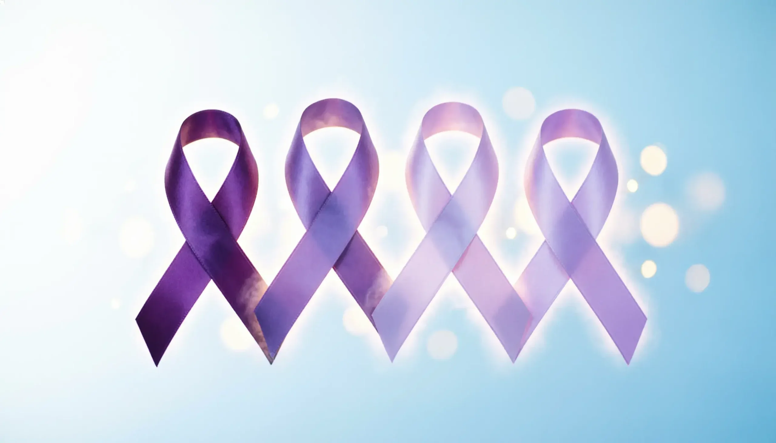 Purple awareness ribbons representing cancer, mental health, and domestic violence causes